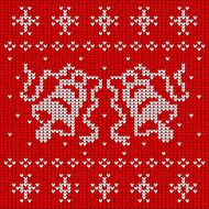 Red knitted sweater with two bells