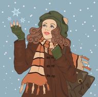 Young girl catches snowflakes
