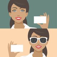 Woman smiling and holds business card