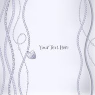 Assorted silver chains on light gray background with heart pendant