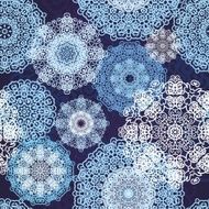 Seamless pattern with laced snowflakes