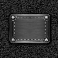 Metal badge on leather background N3