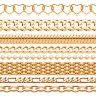 Assorted golden chains on white background