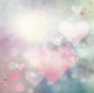 smooth blurry romantic background with heart shaped bokeh