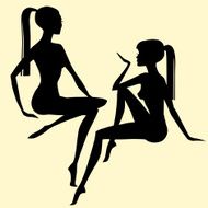 black silhouettes of two sitting women