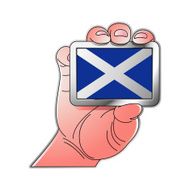 hand holding Scotland flag