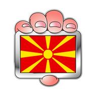 hand holding Macedonia flag