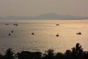 ships on sea in evening