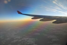 Airplane window view at the sunrise