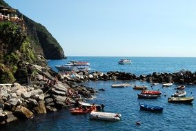 boats on the water near the mountain