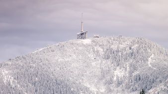 transmitter on top of the mountain in winter