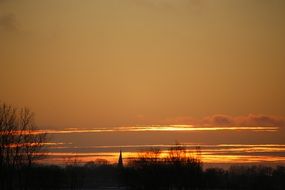 silhouette of church steeple on the evening sky