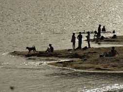 people resting at lake, black and white, argentina