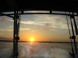 view of the sunrise from a fishing boat