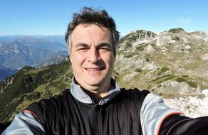 selfie men on a background of mountains
