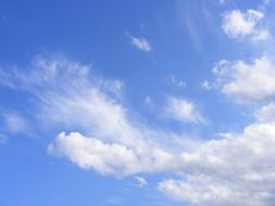 white different clouds in the blue sky