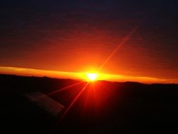 fiery sun on the horizon