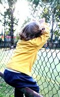 little girl on a railing