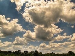 white lush clouds in the sunlight