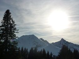 bright sun over the alpine mountains