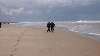 people on the beach in winter