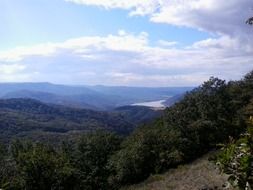 panoramic view of the valley in green trees