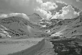 black and white photo of the simpson pass in switzerland