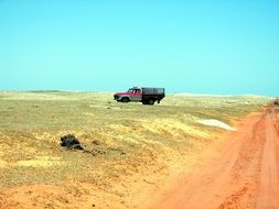 landscape of car on sand beach