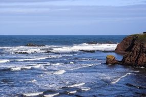 surf near the rocks