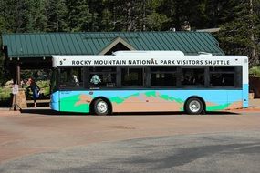 bus at the bus stop near the mountain