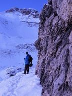 man on the mountain in winter, italy