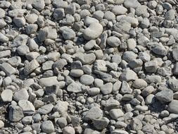 gray pebbles on the beach by the sea