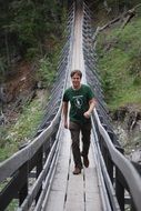 the man on the suspension bridge