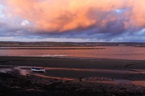 Boat on the coast during sunset