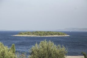 small green island in the ocean