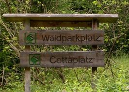 sign with the inscription in the forest