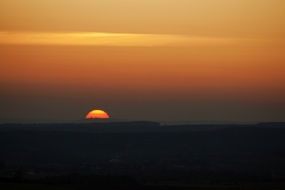 rising red sun over the valley