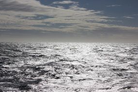 silver ocean under grey cloudy sky