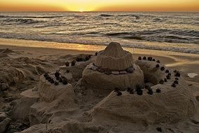 sunset shadows sand castle