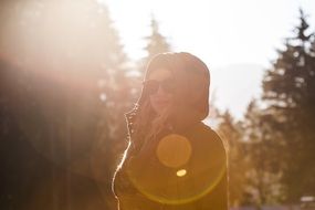 portrait of a woman in a forest at sunset