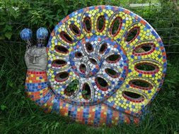 garden sculpture in the form of a colorful snail