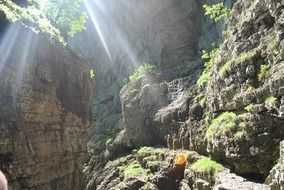 the sun's rays are reflected on the surface of the rocks