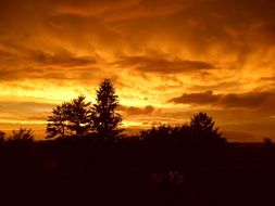 Landscape with the sunset in the clouds