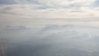 fog high in the mountains view from an airplane