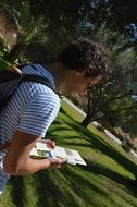 man reading map holiday hiking