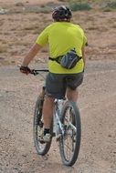 Man is cycling on the road