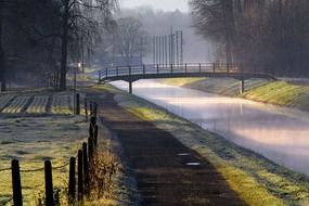 footpath and wooden bridge over the canal