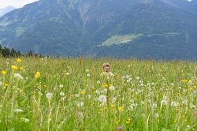 baby on a green meadow