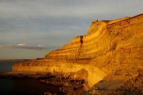 bright sunset reflected on the coastal mountain