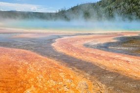 steam over hot springs in Yellowstone